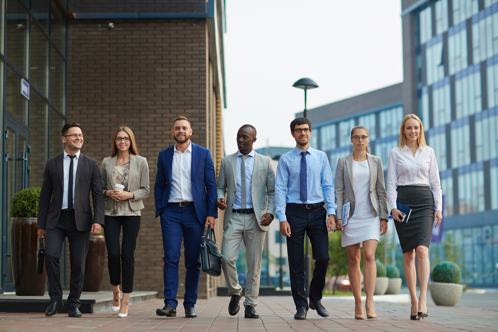 Employees walking in a corporate clothing- CBWM for embroidery and Corporate wears
