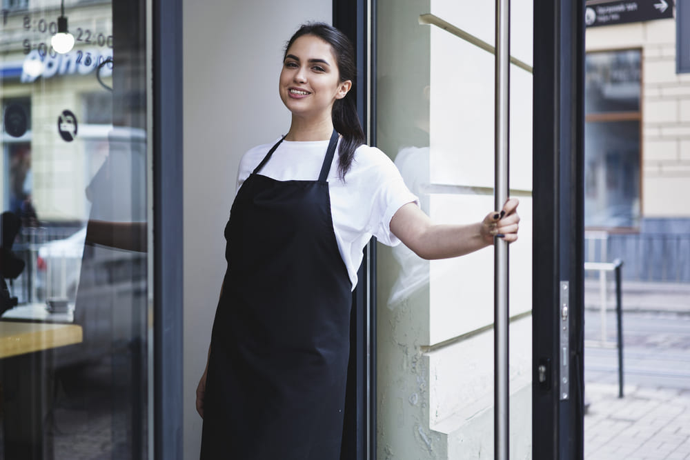 Employee Wearing Corporate Workwear - Apron and Business shirt