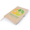 Healthy Living logo printed via embroidery and heat transfer vinyl on a softcover notebook.