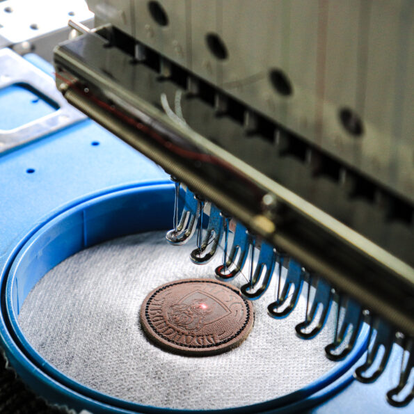 Custom Branded's embroidery attaching logo process