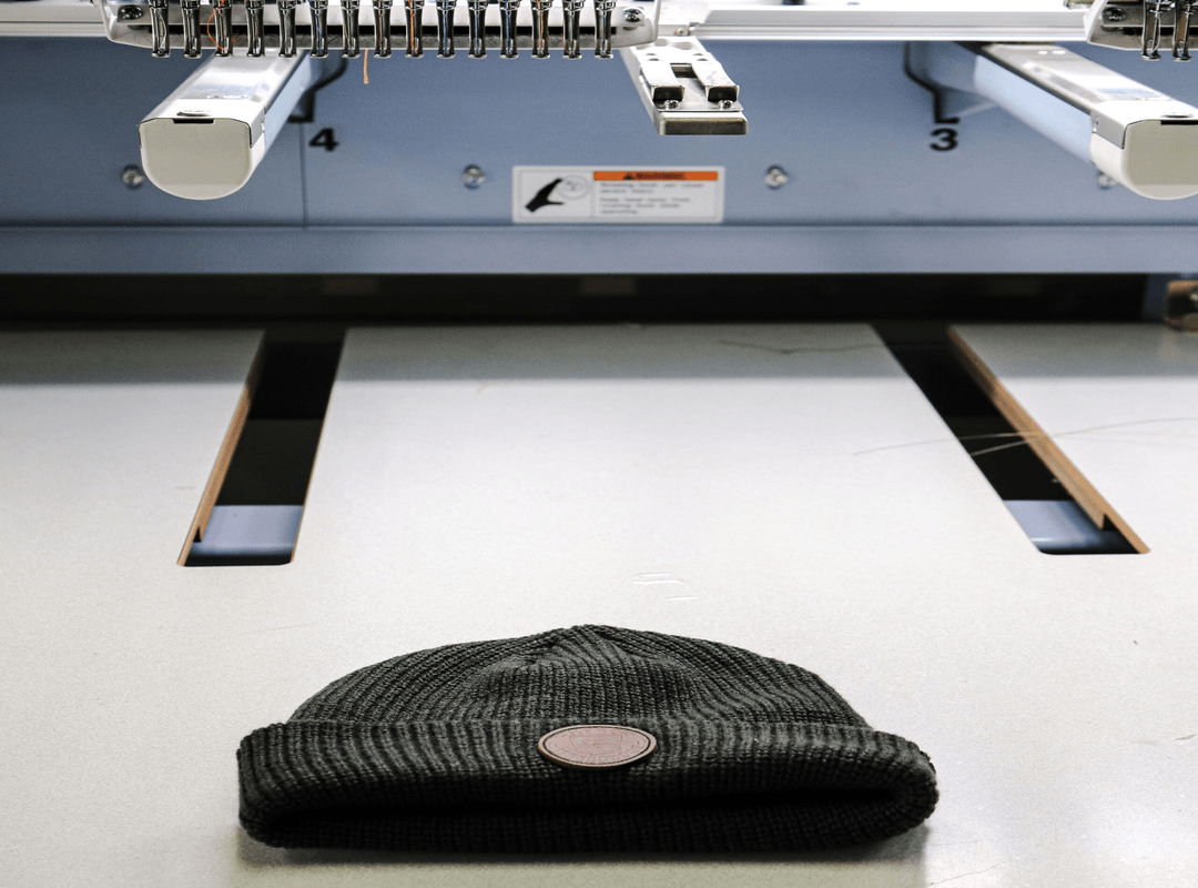 Custom Branded’s logo embroidery on Custom knit cap Custom Branded's logo embroidery on Custom knit cap