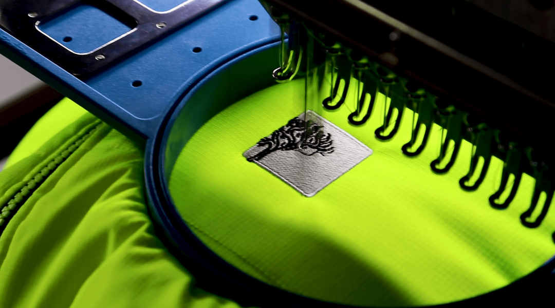 Custom Branded's embroidery processing on a t shirt
